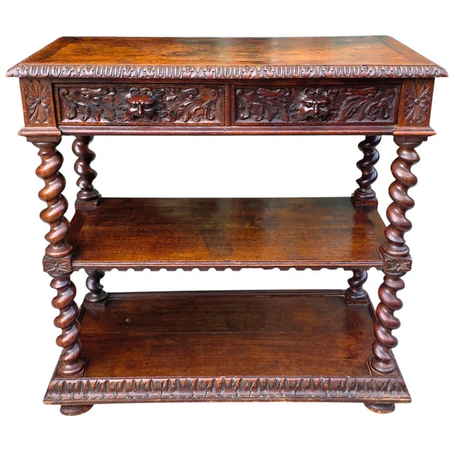 This English Jacobean Revival Oak Server With Carved Grotesque Masks and Barley Twist Supports, Circa 1830 is made of...