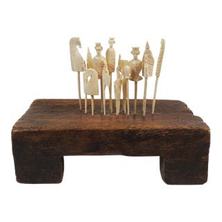19th Century Carved Bone Game Pieces Collection With Wood Stand For Sale