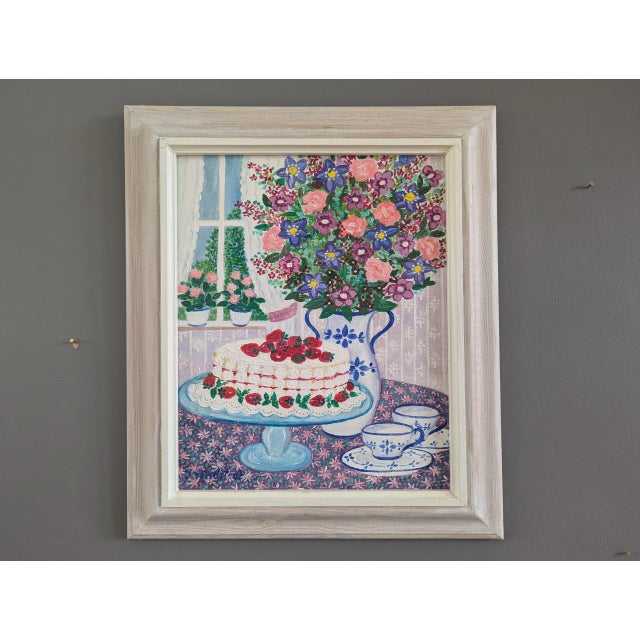 CAKE & BLOOMS Size: 13.8 x 11.8 inches (including frame) Oil on board This interior oil composition, dated 1991 on...
