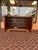 The Ethan Allen Entertainment Cabinet, crafted in exquisite burlwood, is a luxurious piece of furniture that combines...