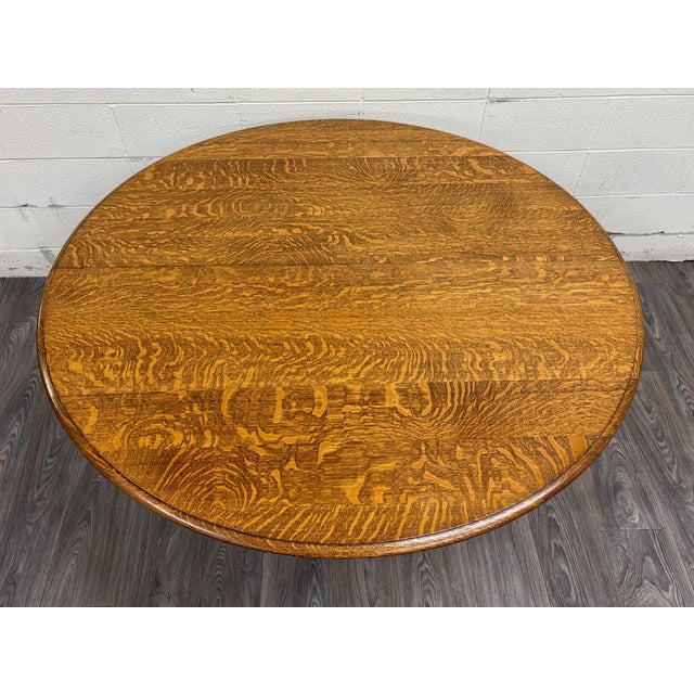 This is a rare early 20th century (1900s) Jacobean Revival dining table crafted from richly figured quarter-sawn oak. The...