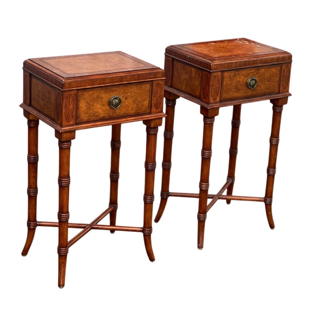 This is a great pair of sofa or bedside tables with a floral medallion drawer pull and wonderful faux bamboo base legs....