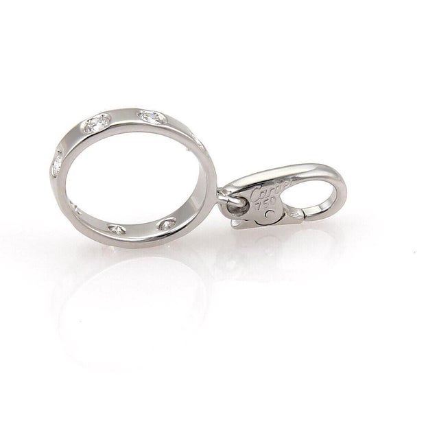Elevate your jewelry collection with the Cartier Love 7 Diamond 18k White Gold Mini Ring Charm. A stunning piece that...
