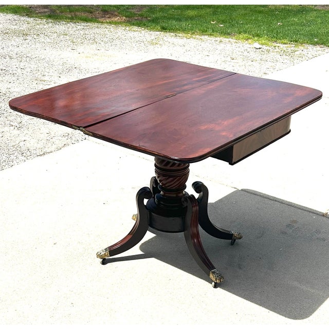 Antique Flame Mahogany, Regency-Style, Flip-Top, Rotating, Game Table, W/Hidden Drawer, Carved Pedestal, Brass Claws and Casters. C1810 to 1820 For Sale - Image 10 of 12