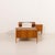 This Danish teak single bed was made in the 1960s. Crafted from solid teak and teak veneer, it embodies warmth, precision,...