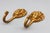A pair of vintage brass lion head wall hooks, featuring bold, expressive detailing and a timeworn finish. Originally...