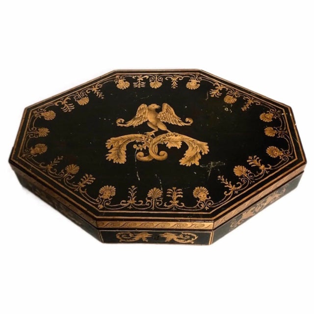 This is a rare Regency period English penwork box, octagonal in shape. The top is decorated with a line border enclosing...