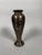 Bronze vase inlaid with gold, silver, and copper. Chinese or Vietnamese work, late 19th century. Nielloed vase decorated...