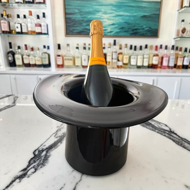 A striking hand-blown Italian art glass champagne cooler, attributed to Murano, dating to the 1970s. Executed in deep jet-...