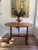 This French Provincial antique vintner's table dates from the 19th century. The wood has a beautifully aged light to...