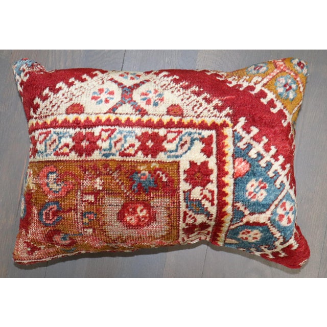 Pillow made from an early 20th century Turkish rug. Measures: 12" x 16''