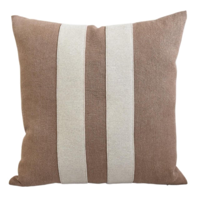 Custom-tailored pillow created from a brown linen textile. Pillow has two cream-colored wool appliqué stripes on the...