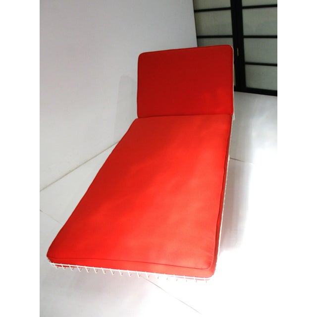 A very rare plastic coated wire chaise lounge chair with adjustable back and head rest with restored knoll fabric . The...