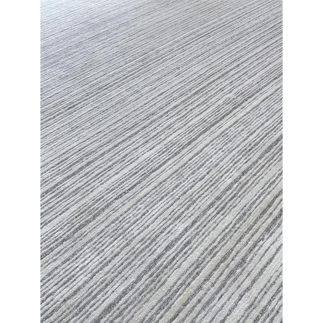 Beautiful hand knotted modern and fashionable collection of borderless designs rug, made of wool & viscose in India. This...