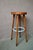 Full of character, this bar stool exudes the joyful spirit of the 1960s. Its round, solid wood seat rests on four slightly...