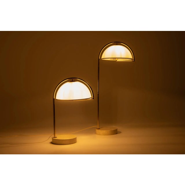 Two beautiful identical arc lamps in different sizes, made in the 1970s by swiss lamps international. They have a marble...