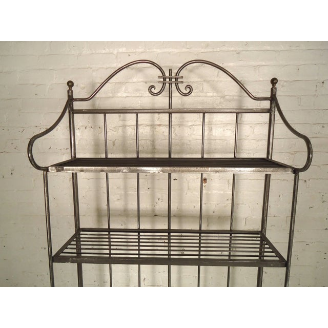 Tall metal kitchen rack, newly stripped and restored in a bare metal style finish. Features four metal shelves and space...