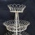 Lovely French three tier vintage iron and wire plant stand having a round form. The three tier frame is decorated with...