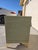 24H by 24W by 22D (inches) Beautifully refinished nightstand featuring a soft sage green finish paired with elegant gold...