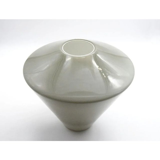 Glass vase produced by Fontana Arte 1970s. In gray and white blown and incamiciato glass of distinctive conical shape. In...