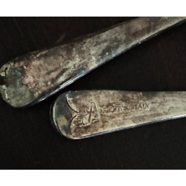 Vintage Italian silver-plated salad servers, marked A.E.P. Zinc Italy. Mid-century form with natural oxidation and time-...