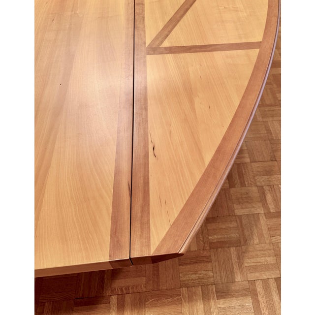 Affusoalato dining table by Adolfo Natalini for Driade. The table is made out of cherry wood. The piece comes with two...