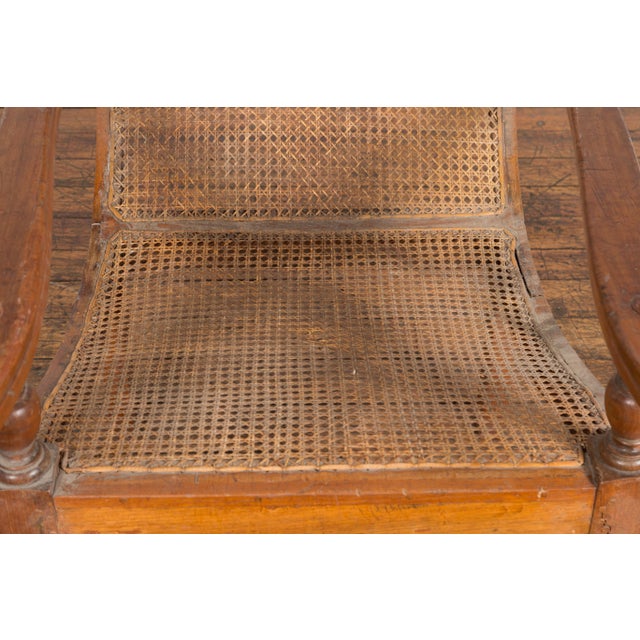 Dutch Colonial Indonesian Cane and Wood Plantation Chair with Extending Arms For Sale - Image 11 of 12