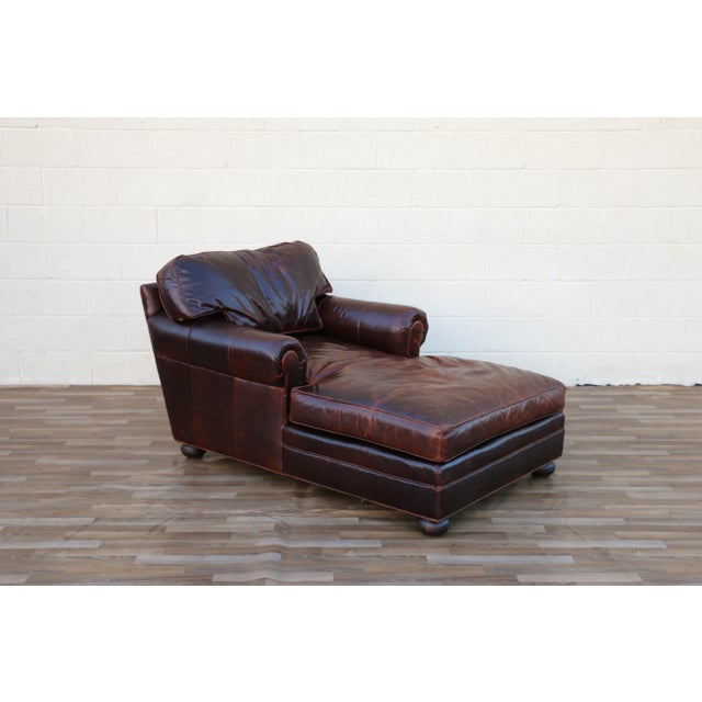 A handsome vintage chaise lounge by Old Hickory Tannery, upholstered in rich brown leather with a beautifully aged patina....