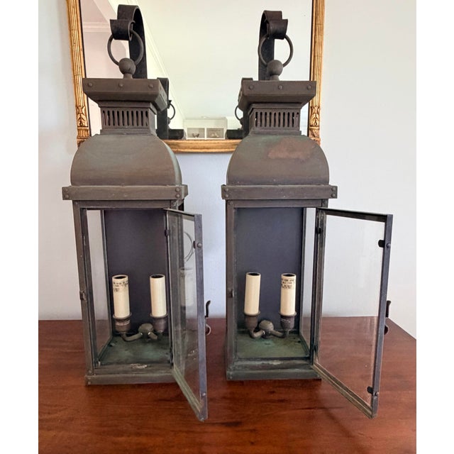 Pair of vintage Suffork Scroll Arm Outdoor Lanterns by Visual Comfort. Made of copper, these have a lovely aged verdigris...
