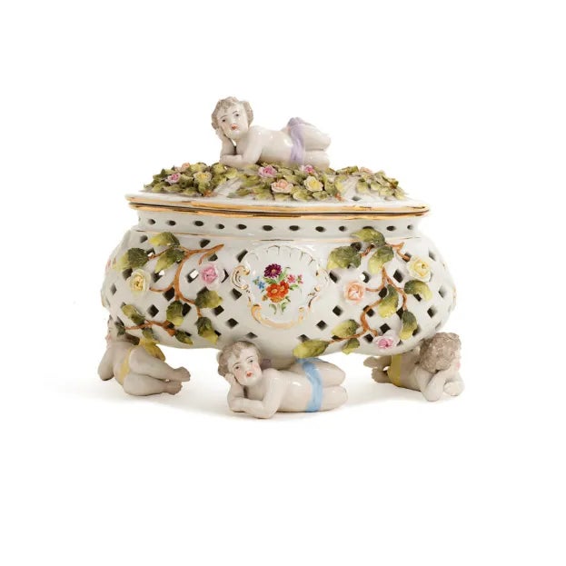 Presenting a Rococo style casket, circa 1950. Quite ornate with floral decor and cherub embellishments. Beautiful piece.