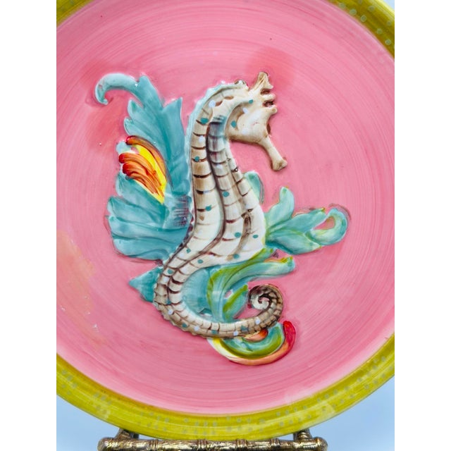 This delightful set of plates features a whimsical and highly decorative coastal motif, showcasing a raised relief...