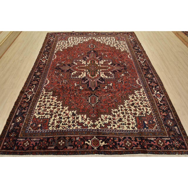 This authentic vintage traditional tribal Heriz rug is hand-knotted with fine wool and natural dyes. This nomadic oriental...