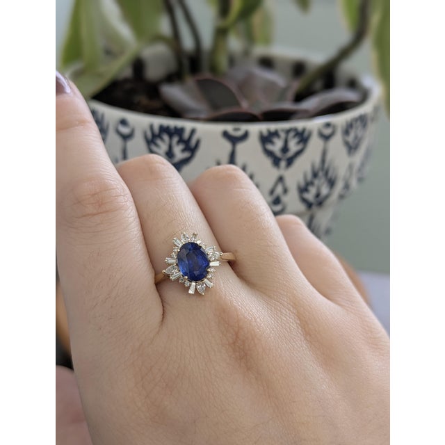 A modern take on a timeless favorite, this 1.86 carat Ceylon blue sapphire ring features a beautifully cut oval center...