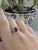 A modern take on a timeless favorite, this 1.86 carat Ceylon blue sapphire ring features a beautifully cut oval center...