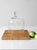 Vintage glass cloche featuring a classic dome form and rounded knob handle. Crafted from clear glass with a smooth, simple...