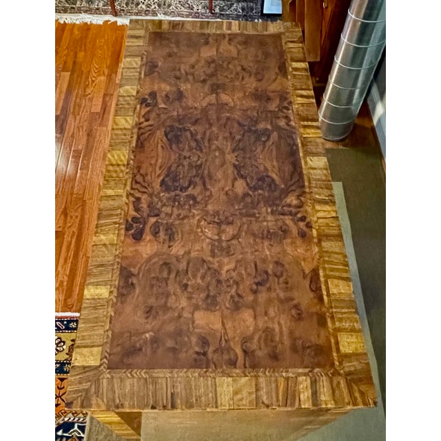 Mid-18th century English chest of drawers in richly figured burl walnut, featuring a quarter-matched top, feather banding,...