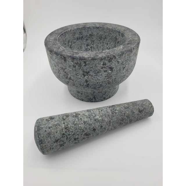 Elevate your culinary workspace with this authentic, hand-carved Thai-style mortar and pestle. Crafted from solid, high-...