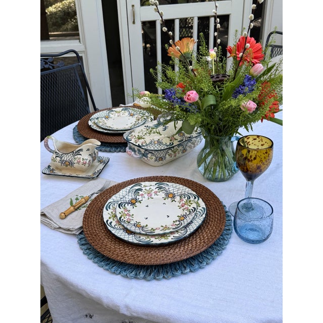 Cream earthenware hand painted plate with flowers and lattice. Purchased in France. 10” dia 45-650