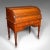 This is an antique roll-top desk. An English, mahogany and leather tambour bureau in Aesthetic Period taste, dating to the...