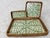 The three-piece nested rectangular tray is made of natural rattan with mother-of-pearl inlay. Craftsmen cut the mother-of-...