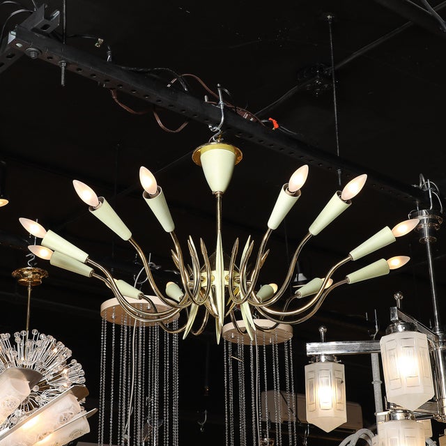 This Mid-Century Modernist twelve-light chandelier by Stilnovo, crafted in Italy circa 1960, is a striking example of the...