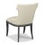 A curved upholstered back wraps around an upholstered seat with welt trim raised by graceful tapering saber legs.