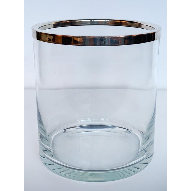 Vintage ice bucket or champagne bottle cooler consisting of a glass body with chrome trim. The design is understated and...