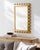 Introducing the Harrison Accent Mirror Wall Decor, a stunning representation of updated traditional style. This remarkable...