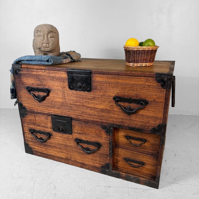 Antique Japanese tansu chest of drawers, dating from ca. 1910–1920, Taishō period, Japan. This low wooden chest is...