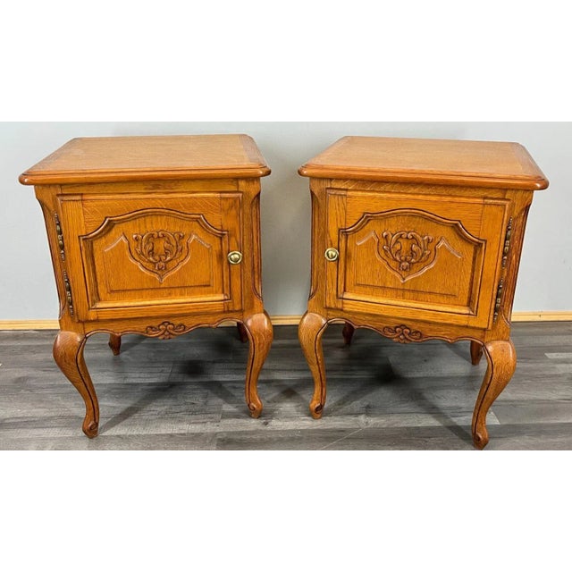 Complete your classic bedroom look with this charming pair of vintage French oak bedside cabinets. Beautifully handcrafted...