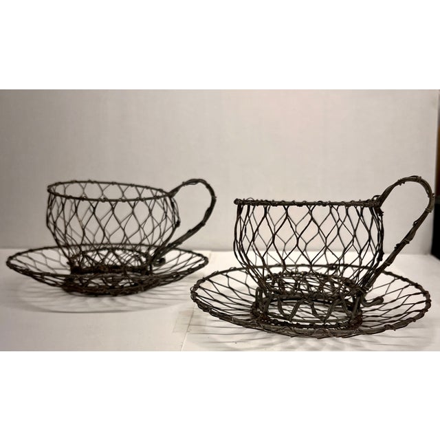 Charming vintage wire folk art set of tea cups for decor.