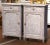 Elegant in their tall, narrow proportions, this handsome pair of antique confiturier cabinets combines restrained Louis...