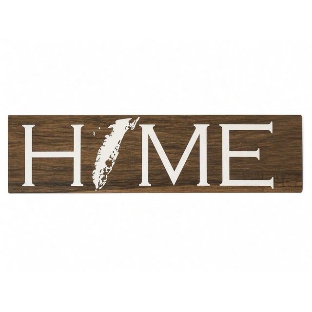 24” x 6”x1/4” Eastern Shore of VA porcelain sign with The Shore silhouette as the O in HOME. It has 2 hangers on the back...