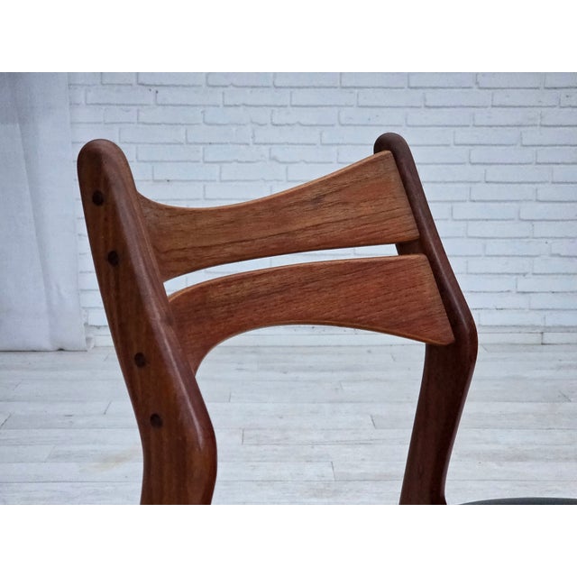 1960s, set of 4 Danish dining chairs. Design by Erik Buck, model 310. Reupholstered by craftsman in quality black...